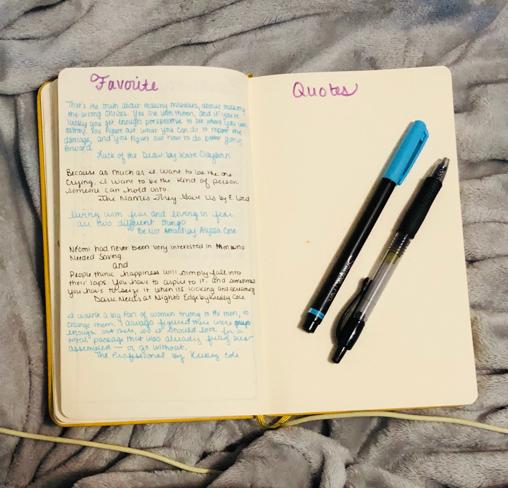 My bullet journal spread with Favorite Quotes across two pages at the top of the pages and then only one page actually filled out and two pens on the other side.